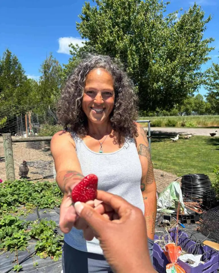 Beth holding strawberry
