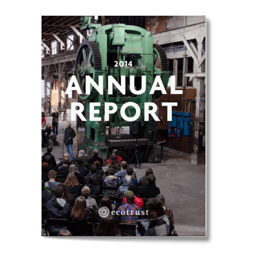 "2014 Annual Report" text, pic behind shows man stands addressing a seated crowd inside a large warehouse with a huge piece of green machinery behind him
