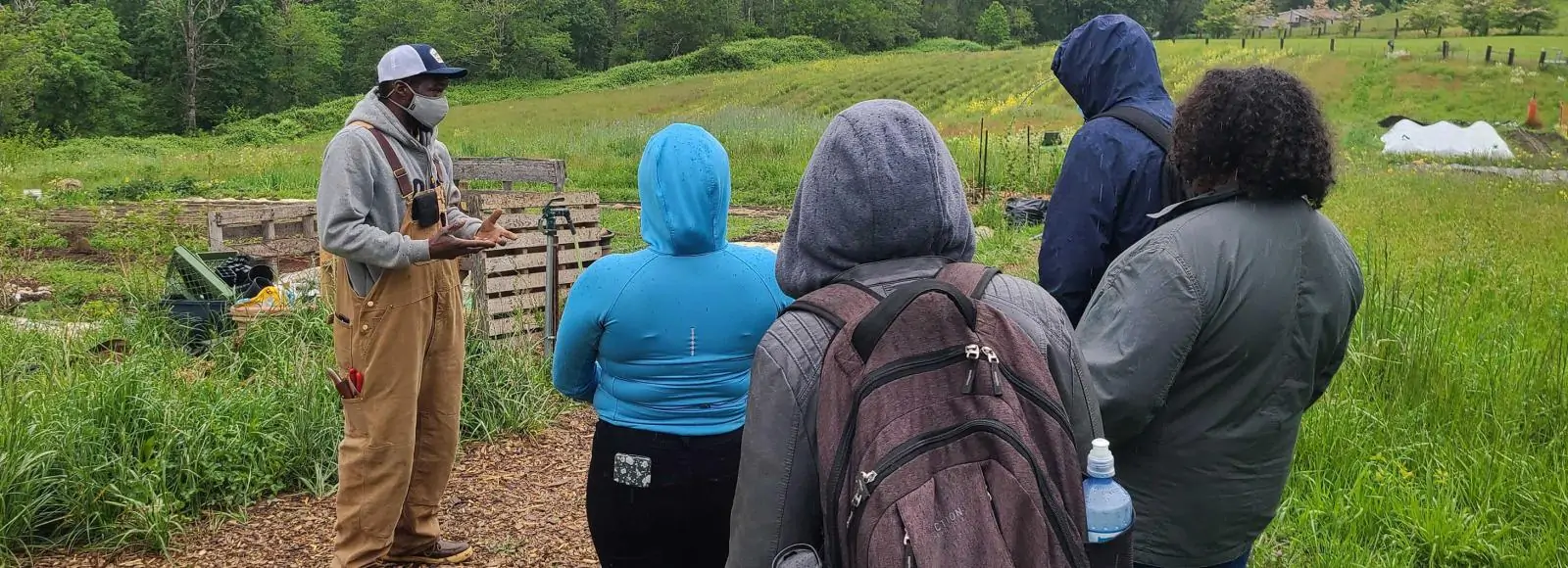 Arthur Shavers, co-owner of Mudbone Grown, give 2021 participants a tour of the farm.