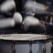 close up view of drumming, drum sticks in motions. decorative drum sticks