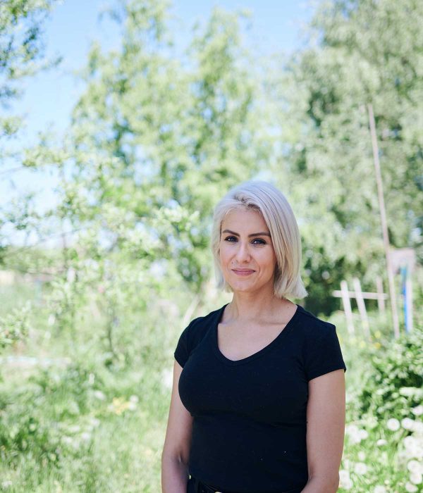 Person looking at camera outside on a farm