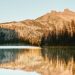 A photo of the peak of Seekseekqua (Mount Jefferson) reflected in Duffy Lake
