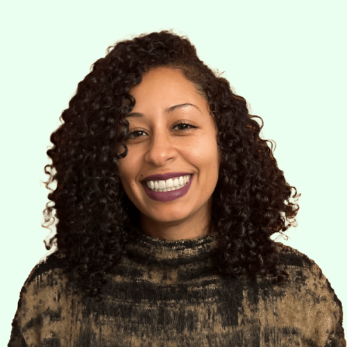 tavasi website smiling person with purple lipstick on a green background